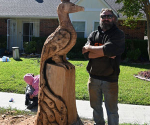 Neighborhood transforms dead trees into sculptures